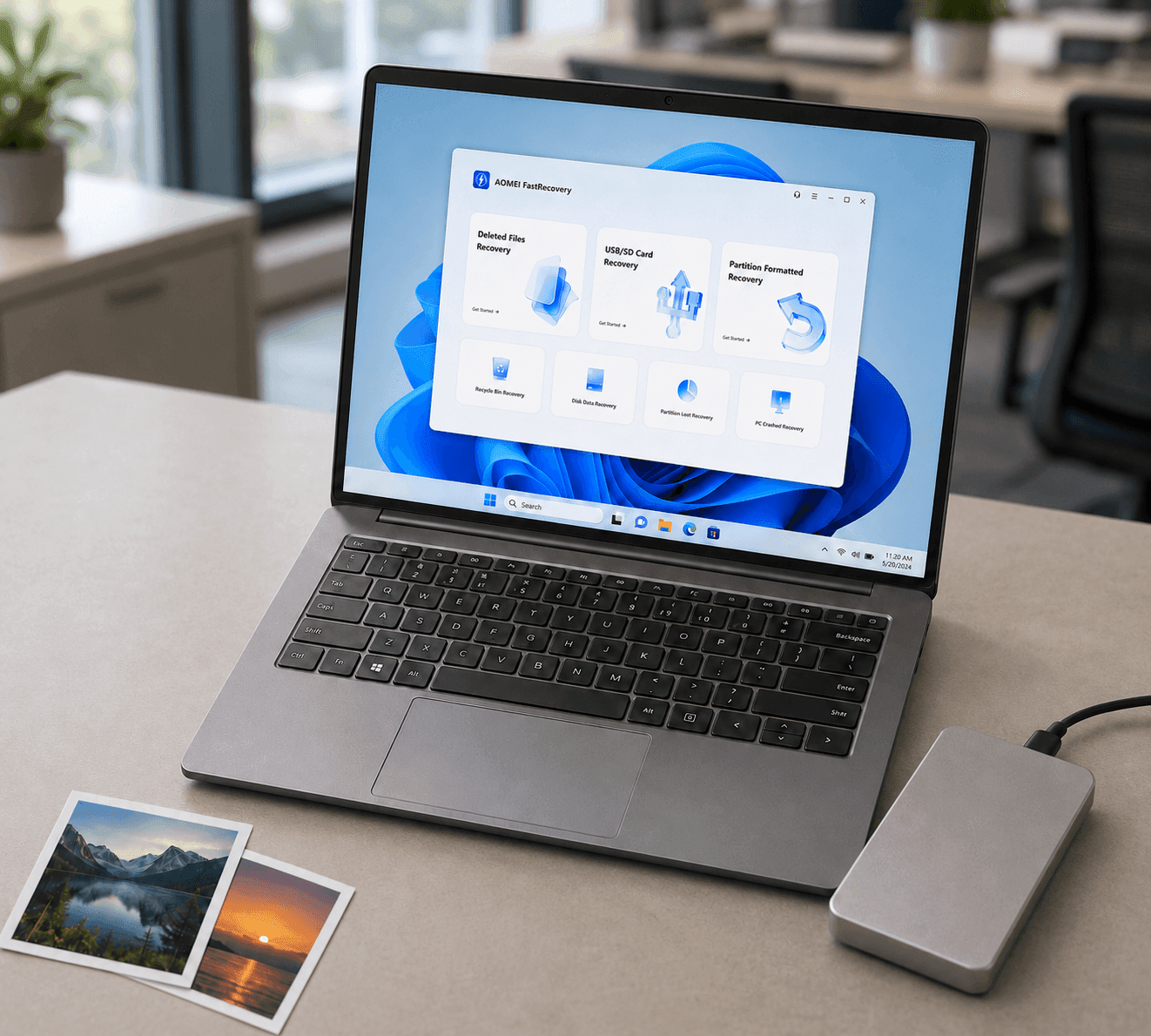 AOMEI FastRecovery on a laptop beside an external drive